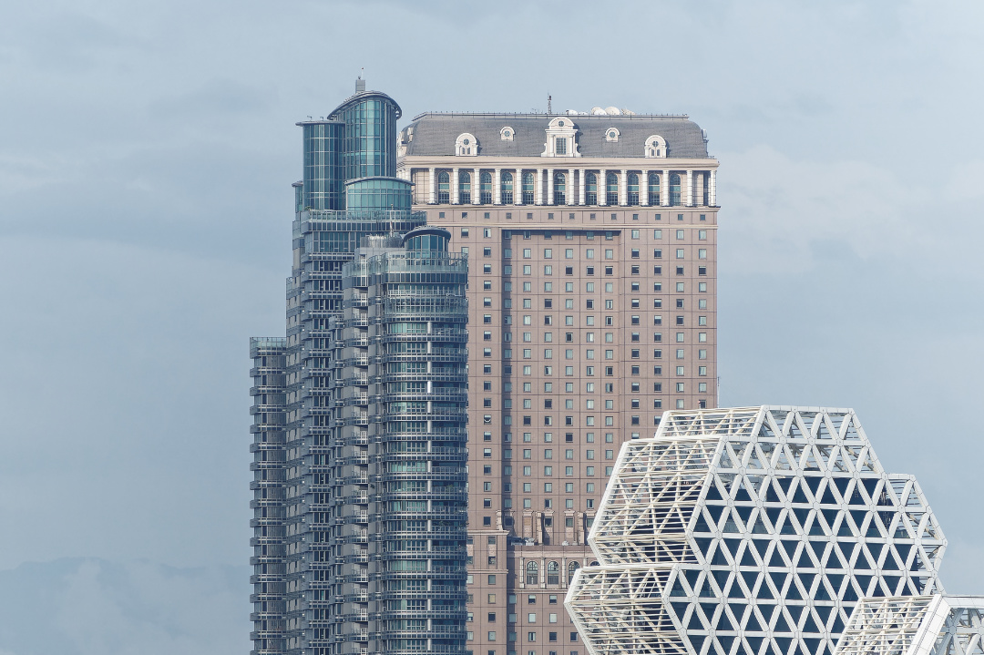 Two skyscrapers behind the Kaohsiung Music Center.